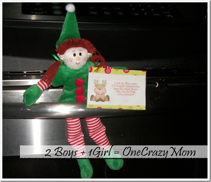 Elf Becky sitting on the oven door
