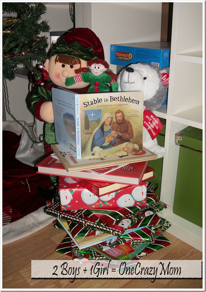 Elf Becky stacking all the books and reading